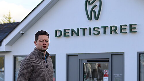 Chris in front of dental practice